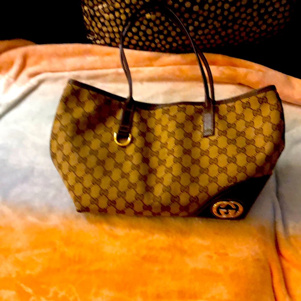 Gucci brown/beige, canvas & leather authentic handbag.